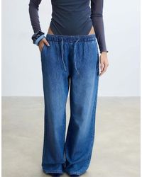 Stradivarius - Flowy Denim Trousers With Drawstring - Lyst