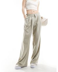 Pull&Bear - Pantaloni sartoriali a fondo ampio color pietra con pieghe - Lyst