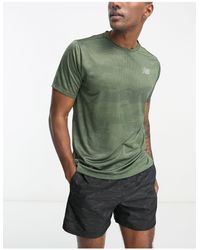 New Balance - Impact run - t-shirt kaki con stampa - Lyst