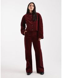 ASOS - Pantalon large à poches en velours côtelé - bordeaux - Lyst