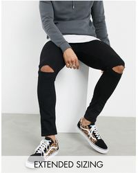 ASOS – hautenge jeans aus powerstretch-denim mit zerrissenen knien - Schwarz