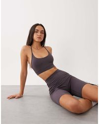4505 - Icon Light Support Sports Bra With Adjustable Straps - Lyst