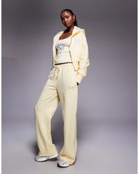 Kaiia - Cotton Rich Embroidered Bow Logo Wide Leg joggers Co-ord - Lyst