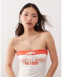 Monki - Co-ord Strapless Bandeau Jersey Top With Orange Contrast Tie Detail And 'tropic Noir' Varisty Print - Lyst