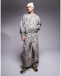 ASOS - Joggers De Corte Globo Holgado Con Estampado De Camuflaje De (Parte De Un Conjunto) - Lyst