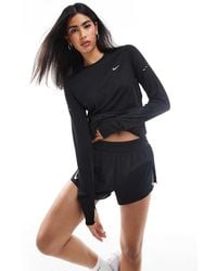 Nike - Aeroswift Dri-fit Plisse Mid Rise Shorts - Lyst