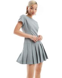 Glamorous - Fitted Drop Waist Pleated Mini Dress - Lyst