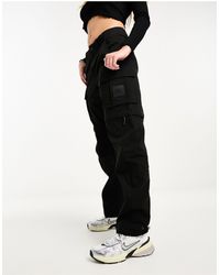 The North Face - Nse convin - pantaloni ampi neri stile cargo con zip - Lyst