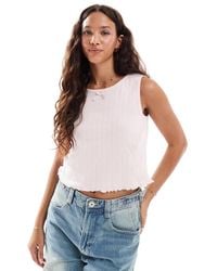 Pieces - Sleeveless Cropped Pointelle Top With Bow Trim - Lyst
