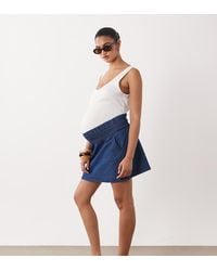 Mama.licious - Mamalicious Maternity Shirred Waist Under The Bump Denim Mini Skirt - Lyst