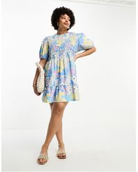 ASOS - Asos design curve - robe babydoll courte en coton à imprimé fleurs avec fronces et manches bouffantes - Lyst