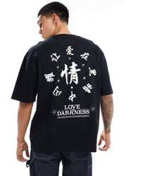 ASOS - T-shirt oversize nera con stampa stile souvenir bianca sul retro - Lyst