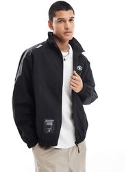 Aape By A Bathing Ape - Aape by a bathing ape - veste zippée en nylon - noir - Lyst
