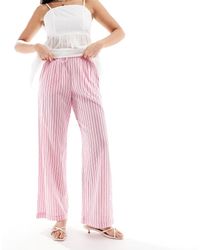 Bershka - Gestreepte Broek Met Wijde Pijpen En Gestrikte Taille - Lyst
