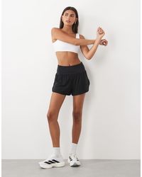 4505 - High Waist Jersey Running Shorts With Back Zipper Pocket And Inner Briefs - Lyst