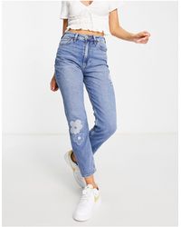 Hollister Mom jeans a vita molto alta lavaggio medio con ricami floreali - Nero