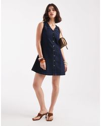 ASOS - Robe courte et sans manches coupe ajustée puis évasée en denim brut - Lyst
