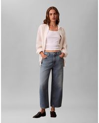 Calvin Klein - Jupe-culotte en jean à taille haute - délavage moyen - Lyst