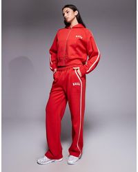 Kaiia - Cotton Rich Embroidered Logo Side Stripe Wide Leg Trackies - Lyst