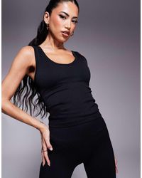 4505 - Canotta Nera Senza Cuciture Con Reggiseno Interno E Scollo A V - Lyst