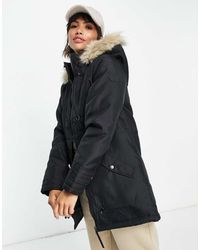 Vero Moda - Parka Negra Con Capucha Y Forro De Piel Sintética De - Lyst
