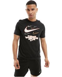 Nike - Dri-fit iykyk - t-shirt nera con grafica - Lyst
