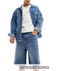ASOS - Jorts di jeans taglio lungo lavaggio medio vintage - Lyst