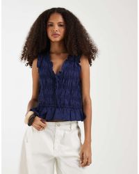 Gap - Sleeveless Tie Front Blouse With Ruffle Detail - Lyst