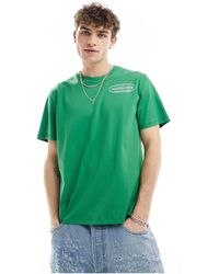 Timberland - Camiseta verde con logo reflectante en la espalda - Lyst