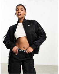 Nike - Giacca bomber nera stile college double-face - Lyst