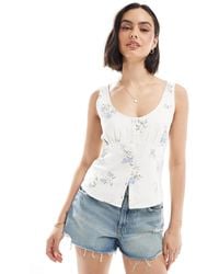 Hollister - Débardeur boutonné en lin avec imprimé fleuri et encolure dégagée - Lyst