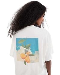 Levi's - Camiseta Blanca Extragrande Con Estampado De Naranja En La Espalda De -Blanco - Lyst