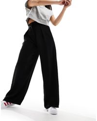 River Island - Pantaloni Neri A Fondo Ampio Con Pieghe - Lyst