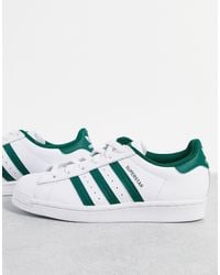 adidas Originals - Superstar - baskets à rayures vertes style universitaire - Lyst