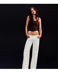 Bershka - Petite Low-rise Studded baggy Jeans - Lyst