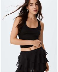 Stradivarius - Minigonna Pantalone Nera Con Volant - Lyst