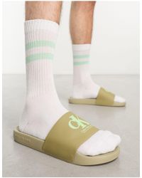 Calvin Klein - Sandalias verdes con monograma - Lyst