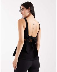 ASOS - Denim Top Met Peplum En Strik Aan De Achterkant - Lyst