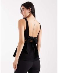 ASOS - Denim Peplum Top With Bow Back Detail - Lyst