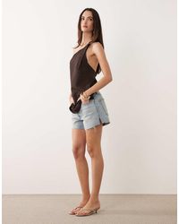 GOOD AMERICAN - Vintage Mid Rise Longline Denim Shorts - Lyst