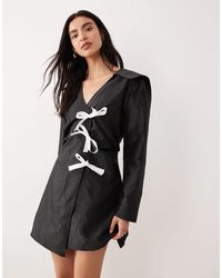 Ghospell - Contrast Bow Wrap Mini Dress - Lyst