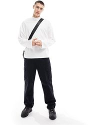 ASOS - T-shirt oversize a maniche lunghe bianca con collo alto - Lyst