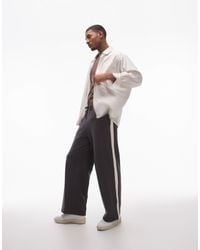 TOPMAN - baggy Leg Trackies With Contrast Side Stripe - Lyst