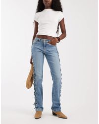 Wrangler - Low Rise Lace Up Bootcut Denim Jeans - Lyst