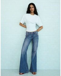 Bershka - Embroidered Low-rise Flared Jeans - Lyst