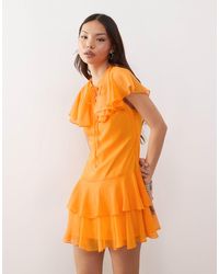 Reclaimed (vintage) - – gestuftes minikleid orange mit cape-detail - Lyst