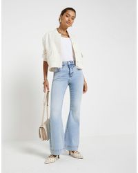 River Island - Petite High Waisted Flared Jeans - Lyst