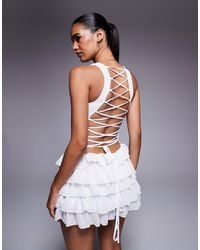 Missy Empire - Mesh Panel Lace Up Back Detail Ruffle Mini Dress - Lyst