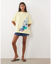 ASOS - Disney Camiseta Oversize Con Estampado De Minnie Surf En Mantequilla - Lyst