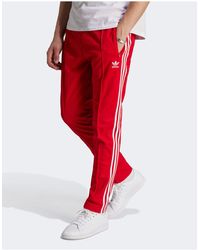 adidas Originals - Adicolor classics beckenbauer - pantaloni della tuta rossi - Lyst